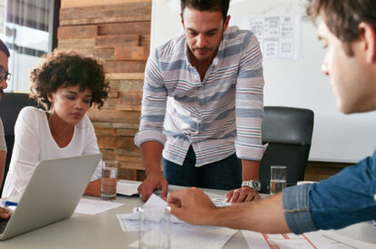 people working together at a conference table