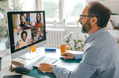 man on zoom call at desk