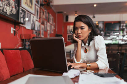 woman looking at a laptop