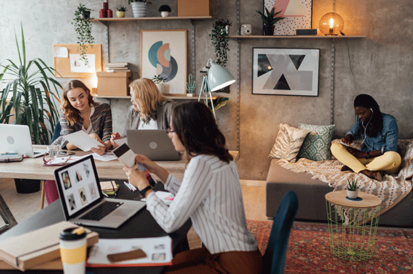 group of people working in a boho office setting