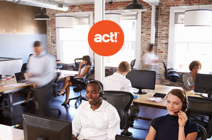 people working in an office space on computers with the act! CRM logo overlayed